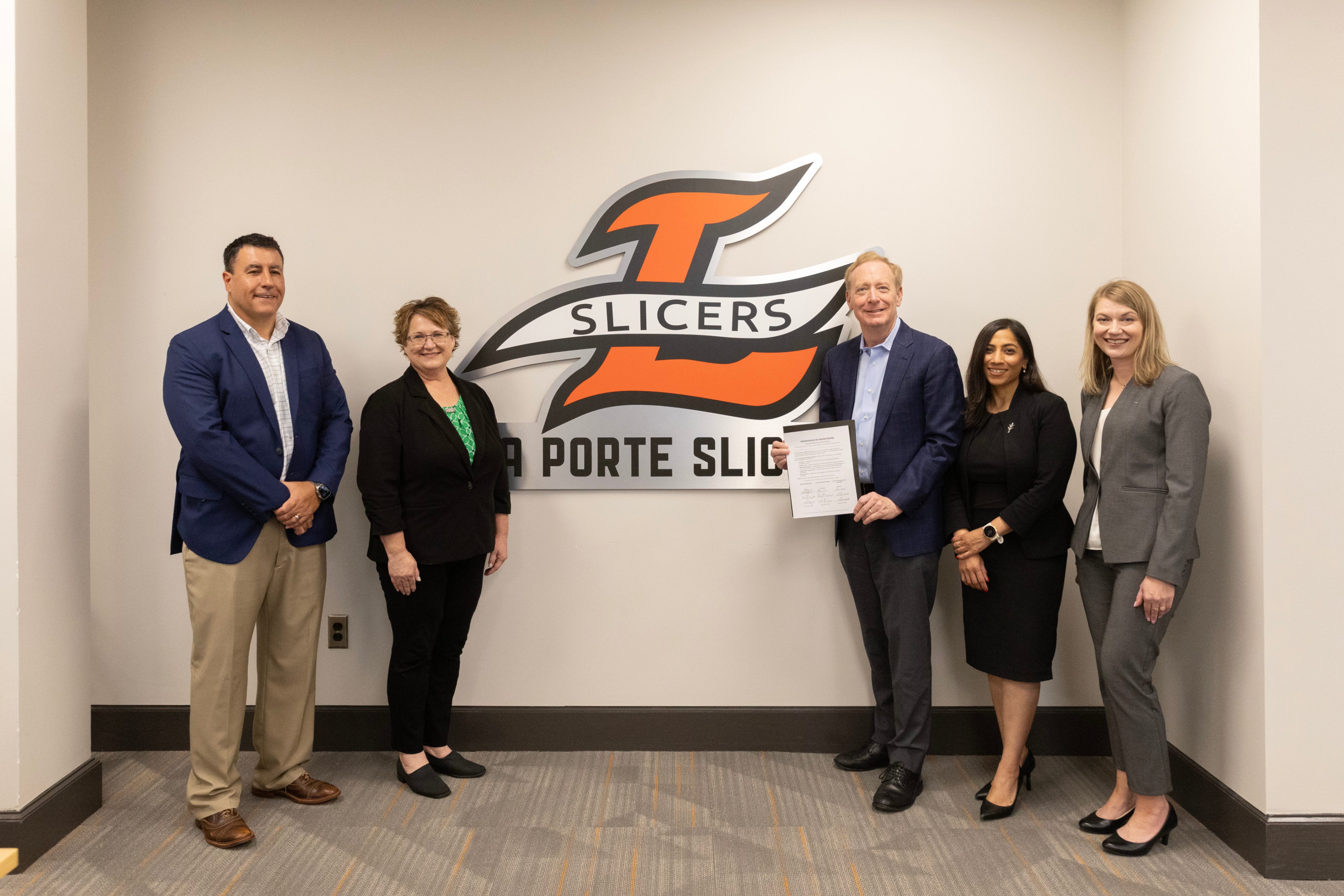Photo credit: Gary Riggs Photography  Left to right: Bo Wallace, Corporate Vice President, Microsoft; Patti Shields, Vice Chancellor  Ivy+ Careers, Ivy Tech Community College; Brad Smith, President, Microsoft Corporation; Sejal Vaishnav, Senior Vice President and Chief Information Officer, Ivy Tech Community College; Dr. Sandra Wood, Superintendent, La Porte Community School Corporation